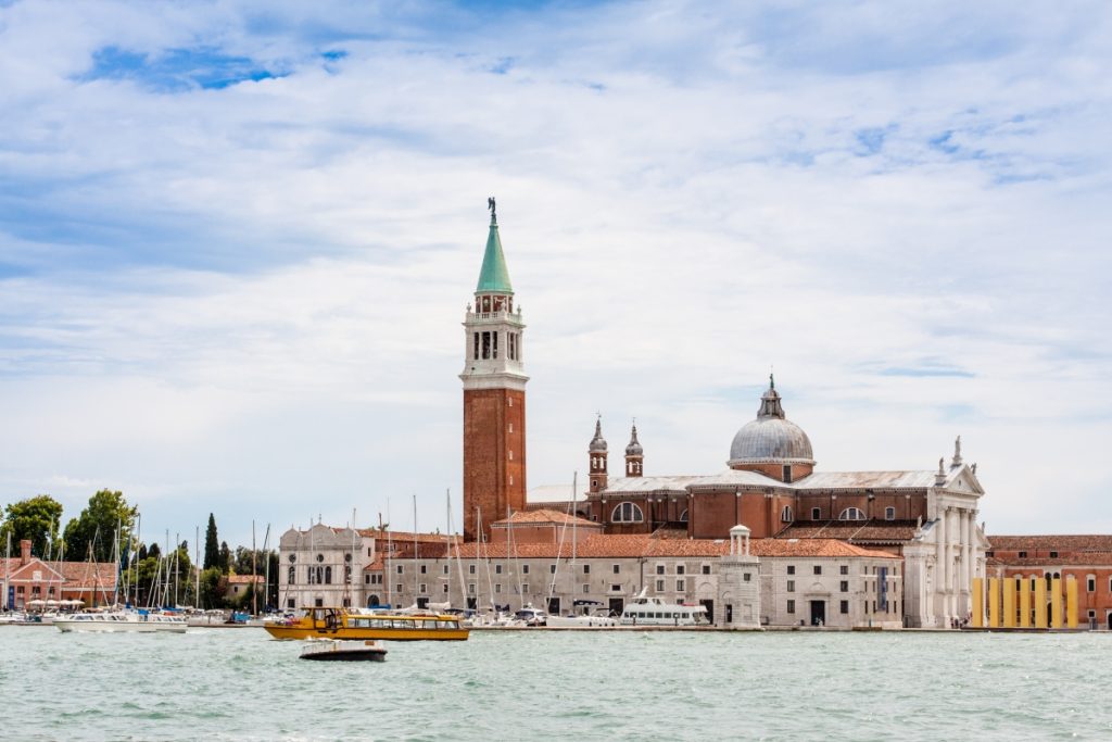 San Giorgio Maggiore church on its island in Venice with its white façade and bell tower overlooking the lagoon.