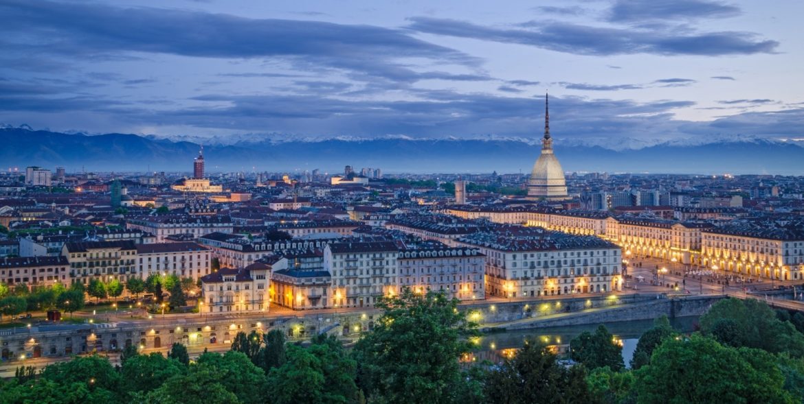 Panoramic cityscape of Torino Italy with historic landmarks and mountain backdrop