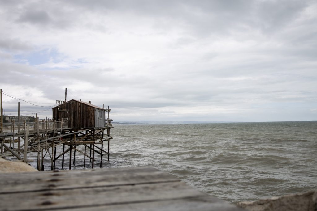Why visit Molise Italy? For the traditional trabucchi fishing platforms along the coast of Termoli, Italy, standing on wooden stilts over the Adriatic Sea.