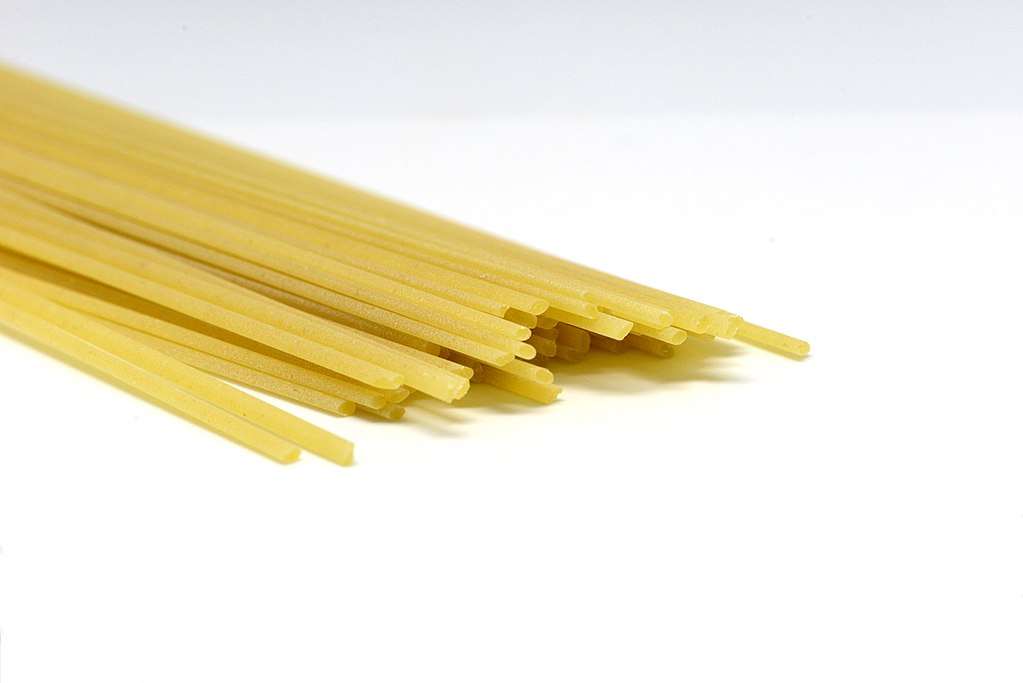 Linguine pasta closeup on a white background